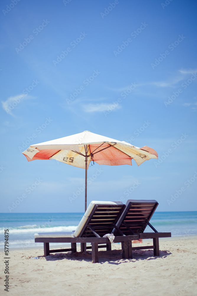 Sun loungers with an umbrella