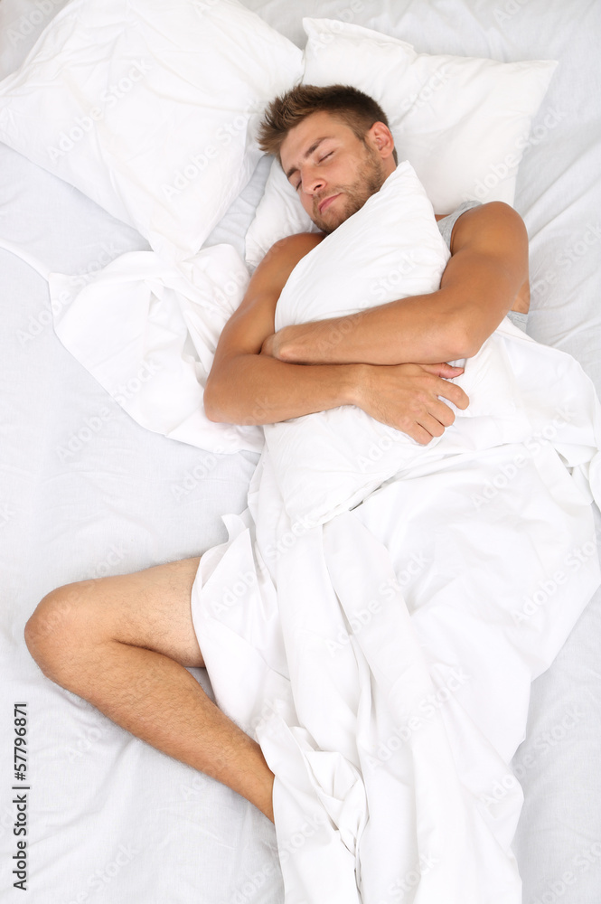 Handsome young man in bed Handsome young man in bed