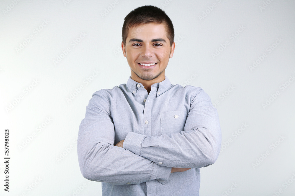 Portrait of young man on grey background Portrait of young man on grey background