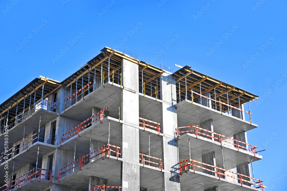 Building construction site work against blue sky Building construction site work against blue sky