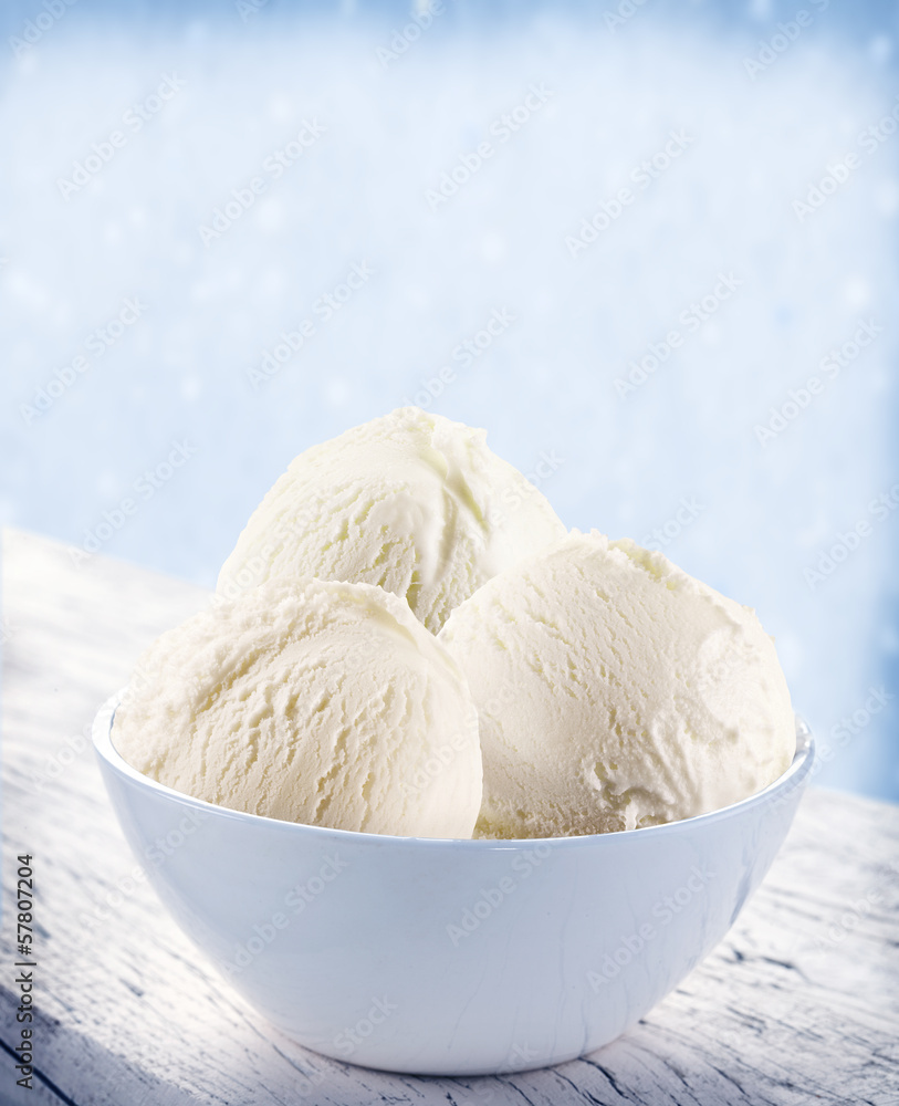 Vanilla ice-cream scoops in white cup. Vanilla ice-cream scoops in white cup.