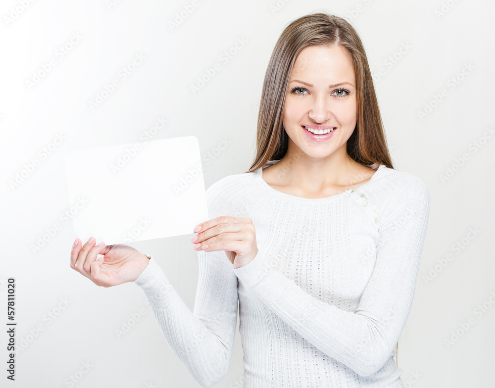 young smiling woman holding blank business card young smiling woman holding blank business card
