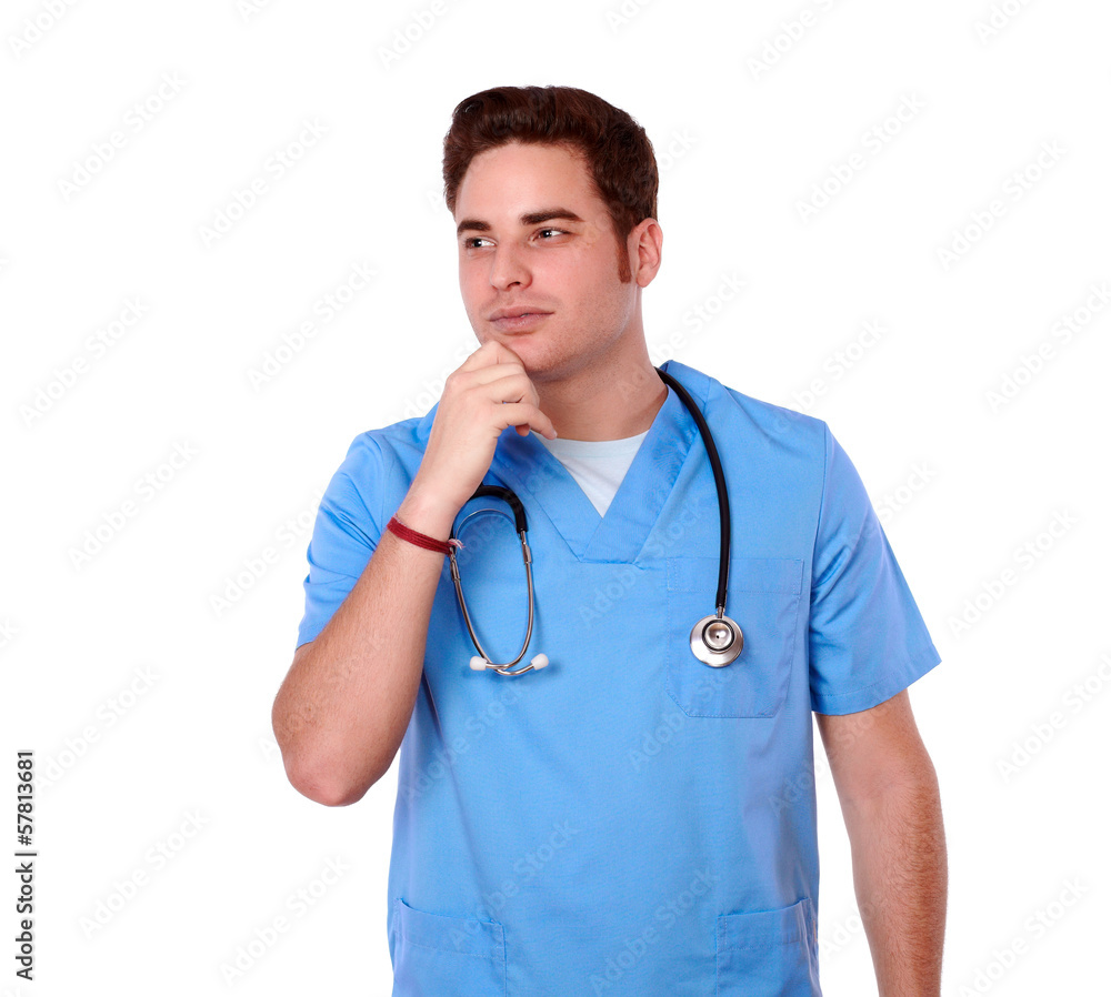 Pensive male nurse looking to his right Pensive male nurse looking to his right