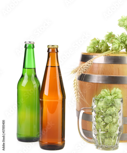 Barrel mug with hop and bottle of beer.