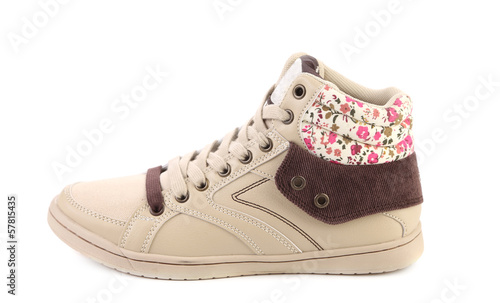 Fashion sneaker with flower closeup.