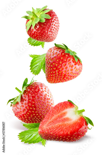 Fototapeta Naklejka Na Ścianę i Meble -  Falling strawberries. Isolated on a white background.