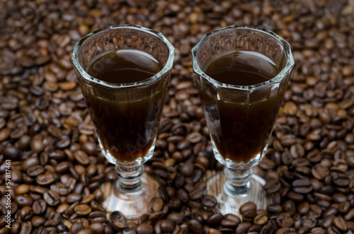 two shot glasses of coffee liqueur, selective focus horizontal photo