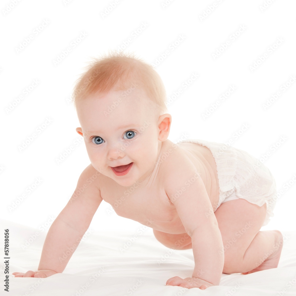 Cute baby with beautiful blue eyes on the white bed