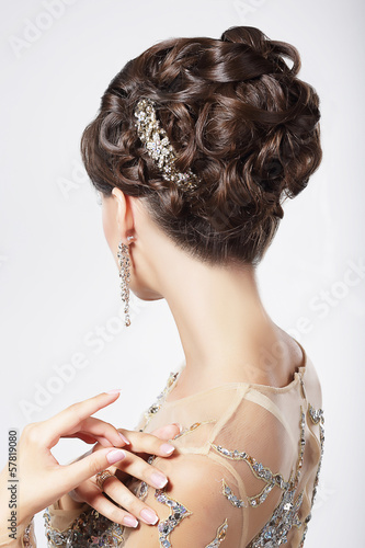 Refinement. Sophistication. Stylish Woman with Festive Coiffure