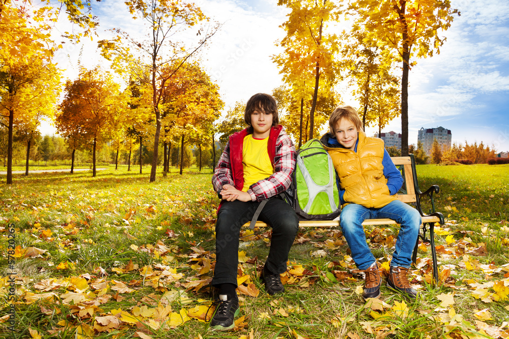 Two boys in autumn park