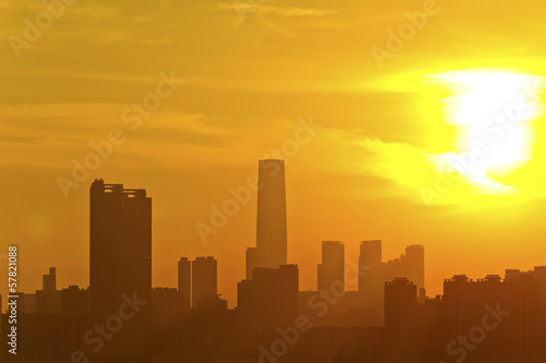 City skyline silhouetted against sunset