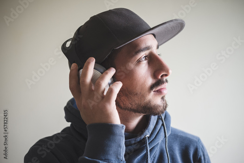 young stylish man listening to music