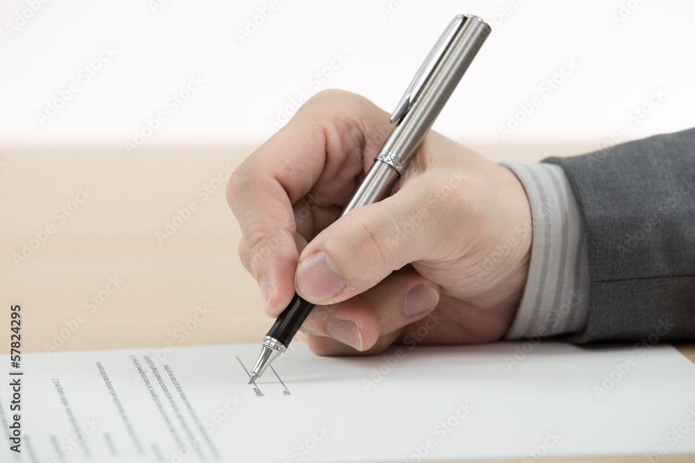 Business man signing finance contract Business man signing finance contract
