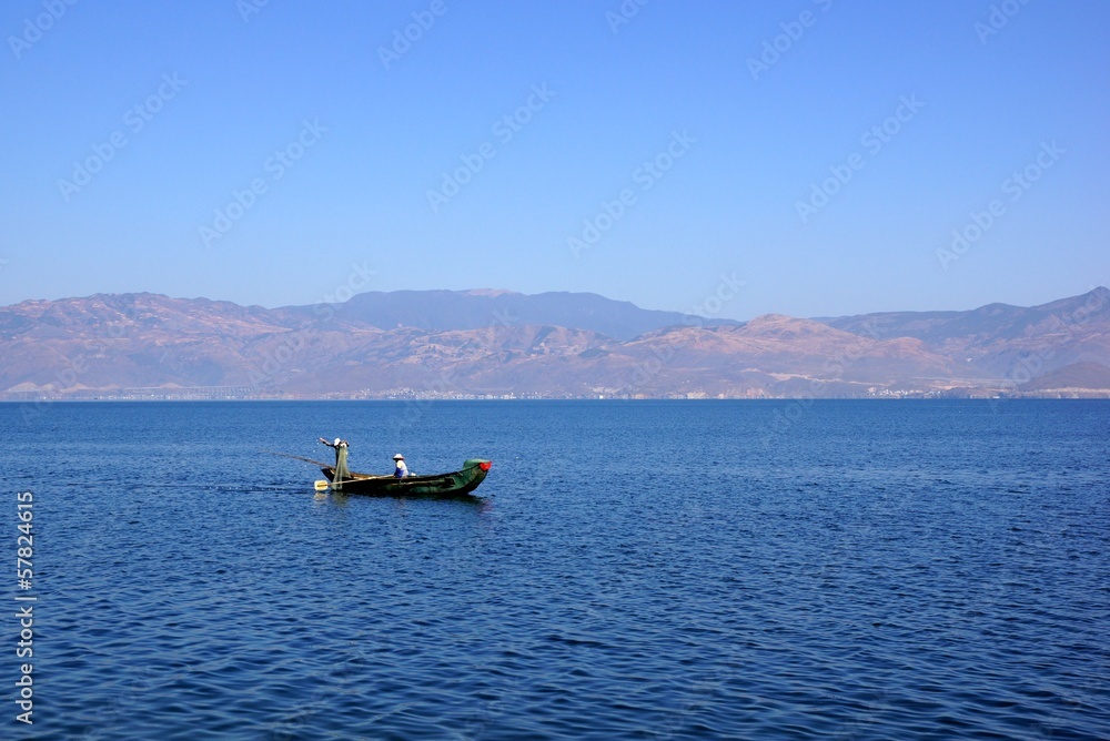 People fishing on Erhail lake, Dali, Yunnan province, China