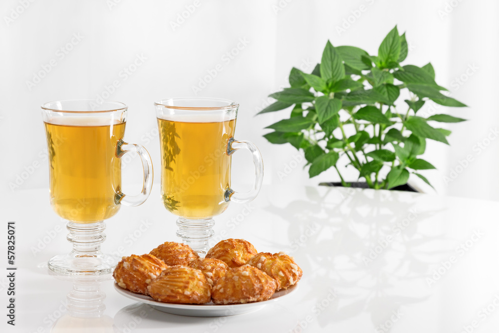 Tea in glass cups and tasty cookies Tea in glass cups and tasty cookies