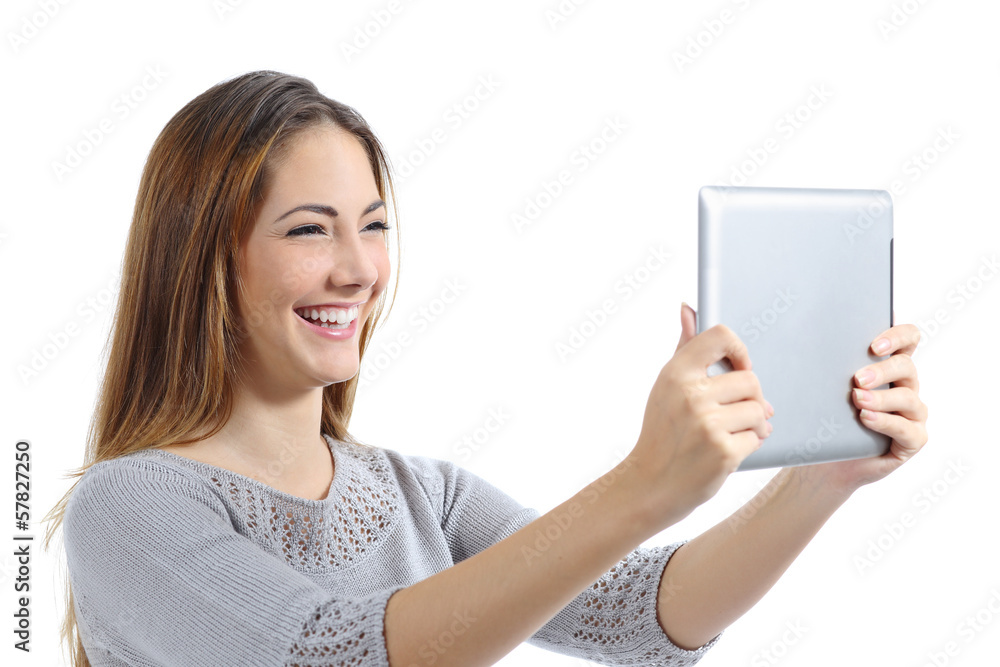 Beautiful woman laughing watching a digital tablet Beautiful woman laughing watching a digital tablet