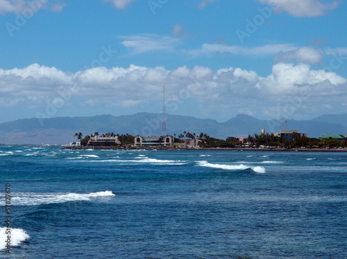Waves roll along the coast of Kakaako Waterfront Park and surrou