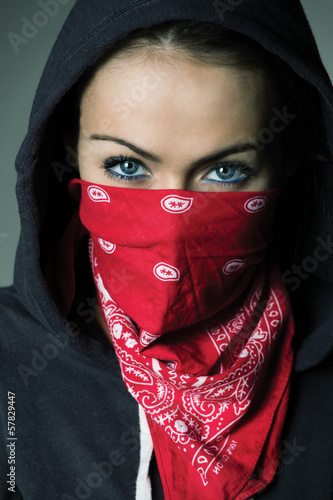 girl hood and red scarf covered face