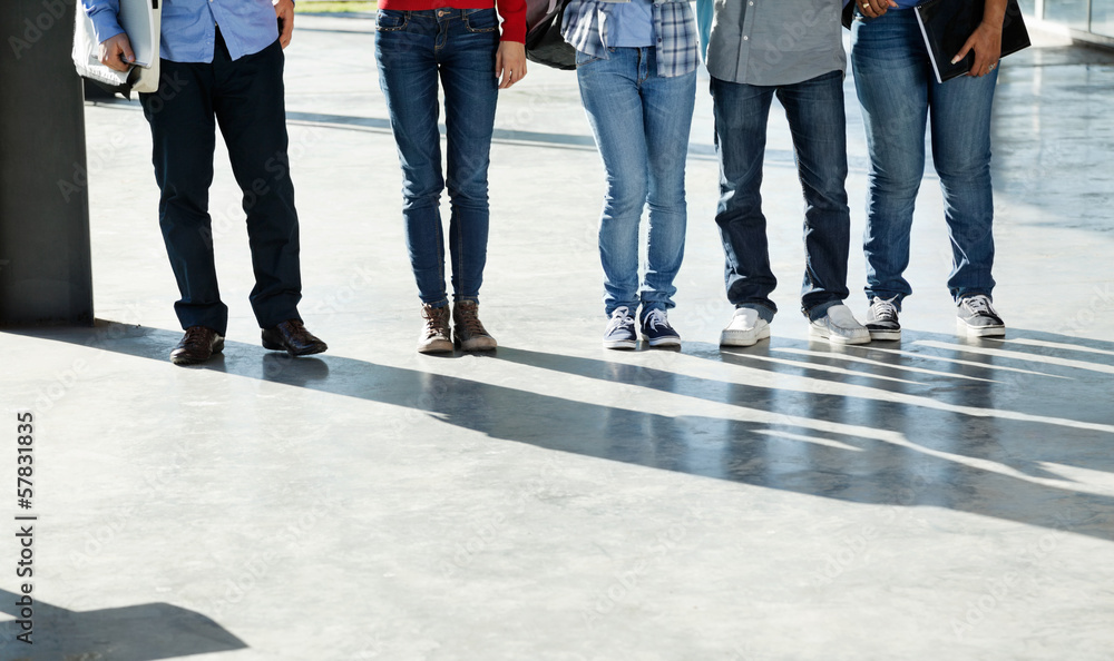 College Students Standing In A Row On University Campus College Students Standing In A Row On University Campus