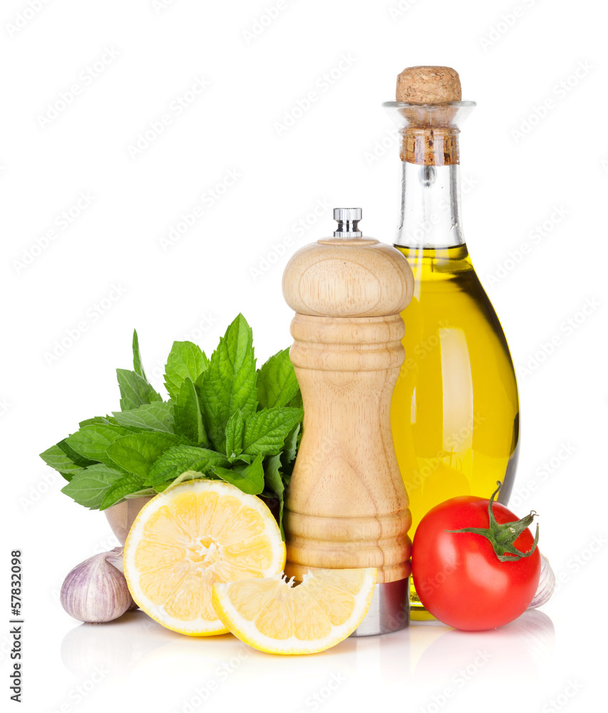 Fresh herbs, tomato, olive oil and pepper shaker Fresh herbs, tomato, olive oil and pepper shaker