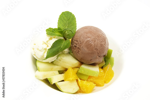 fruit salad with ice cream on white background