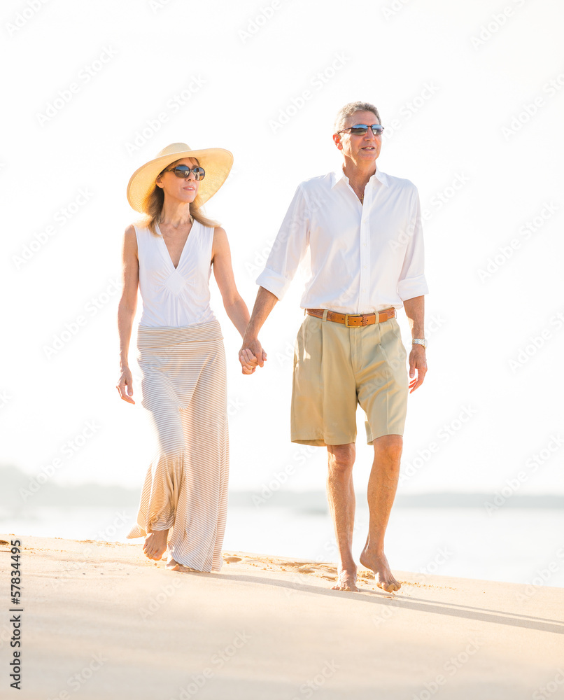 Happy senior couple on the beach. Retirement Luxury Tropical Res Happy senior couple on the beach. Retirement Luxury Tropical Res