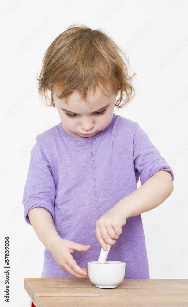 child working with mortar child working with mortar