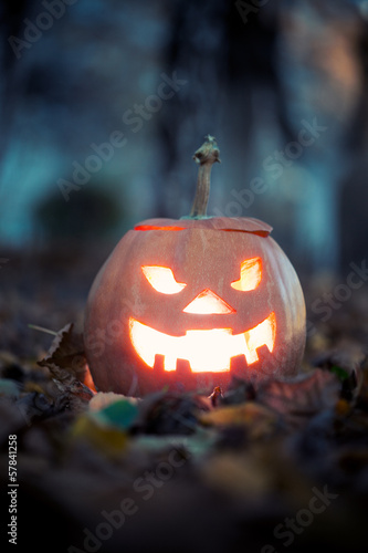 halloween jack-o-lantern on autumn leaves