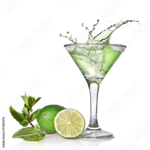 Green alcohol cocktail with splash, lime and mint isolated on wh #57845470