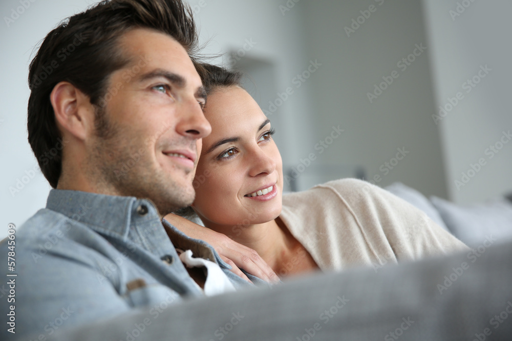 Couple at home relaxing in sofa Couple at home relaxing in sofa