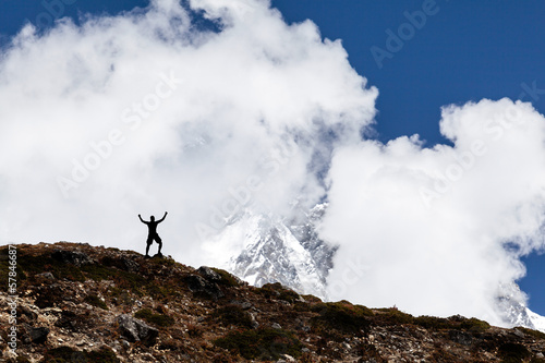 Man hiking silhouette in mountains