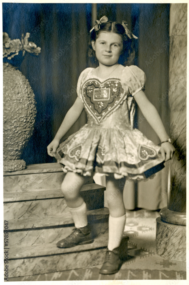Girl in national costume with a big heart - circa 1955 Girl in national costume with a big heart - circa 1955