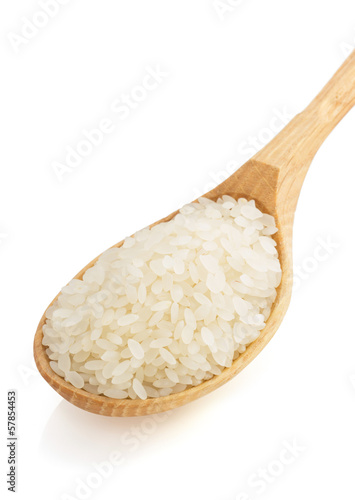 rice in spoon on white background