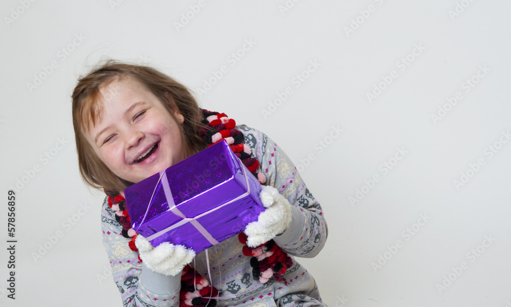 Funny Little girl opening a gift Funny Little girl opening a gift