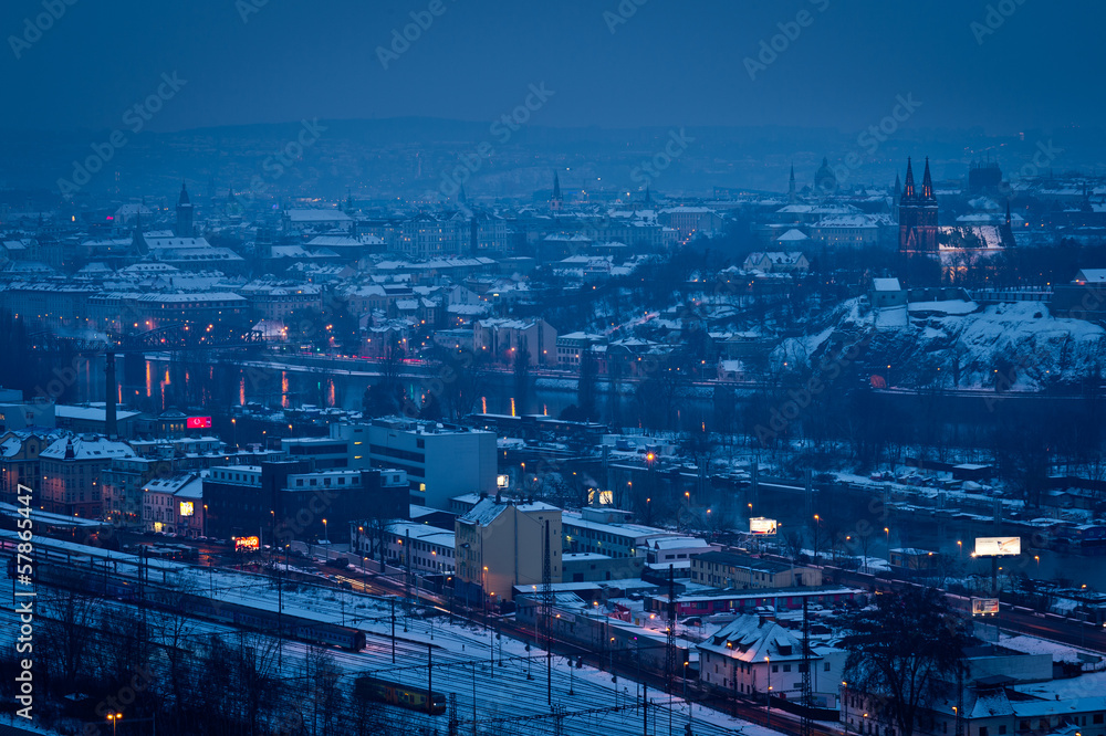 Night view of city with church and railway station Night view of city with church and railway station