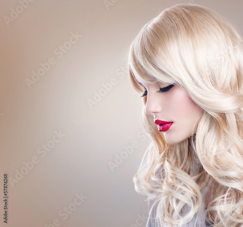 Blonde Woman Portrait. Beautiful Blond Girl with Long Wavy Hair #57876268