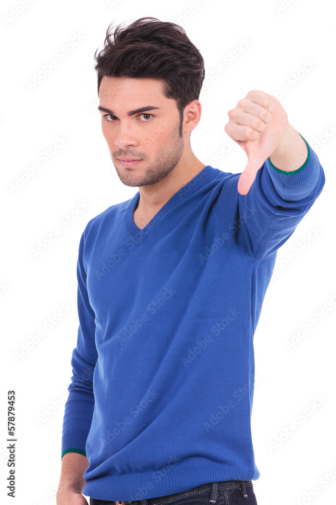 man making the thumbs down negative hand sign man making the thumbs down negative hand sign
