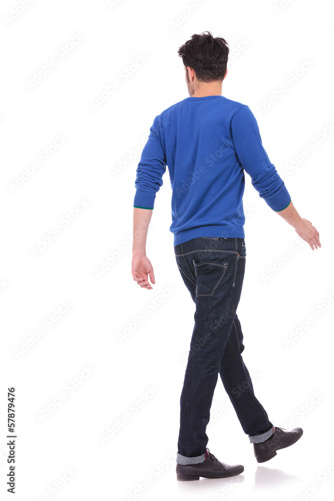 back view of a walking casual man looking to a side back view of a walking casual man looking to a side