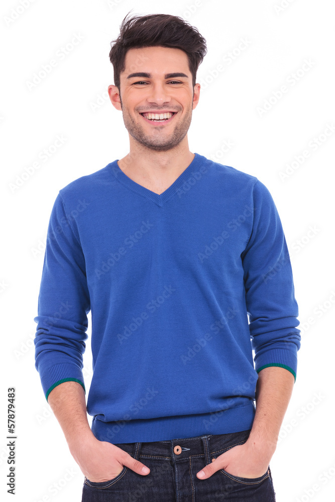 Fototapeta premium young casual man with hands in pockets smiling