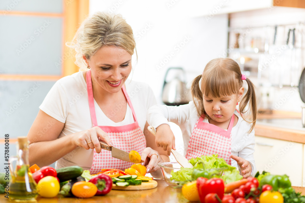 mom and kid girl preparing healthy food