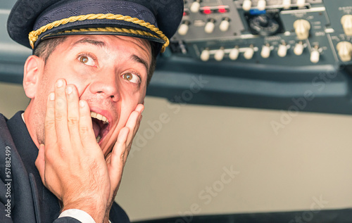 Panic in the airplane with pilot screaming for sudden failure photo