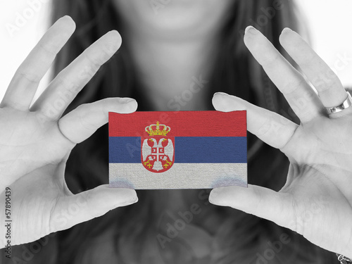 Woman showing a business card