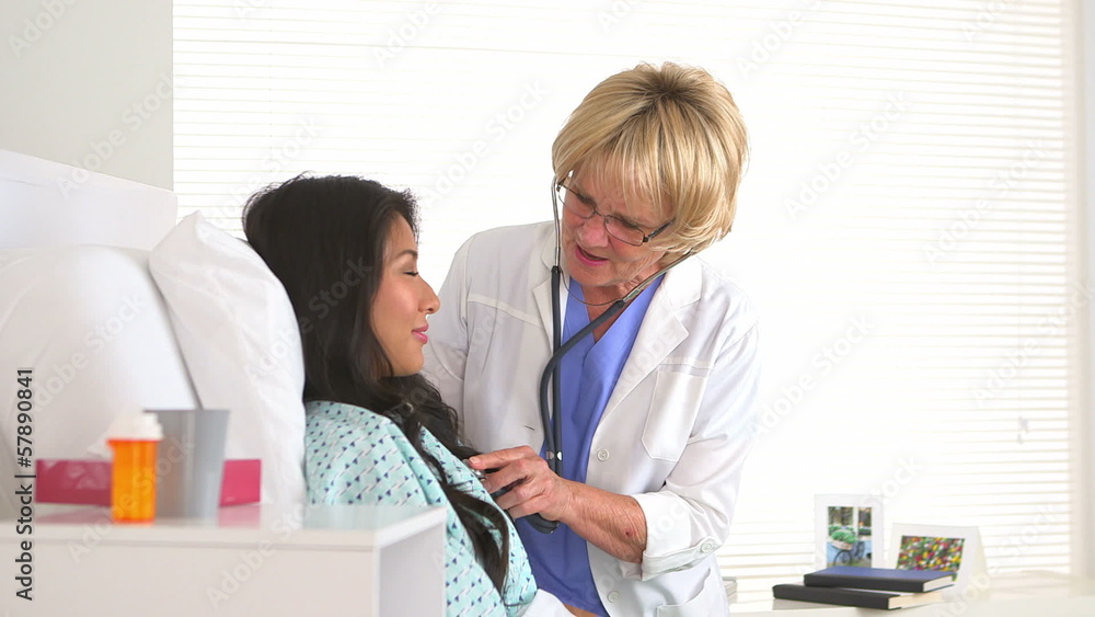 Doctor checking her patient's pulse Doctor checking her patient's pulse