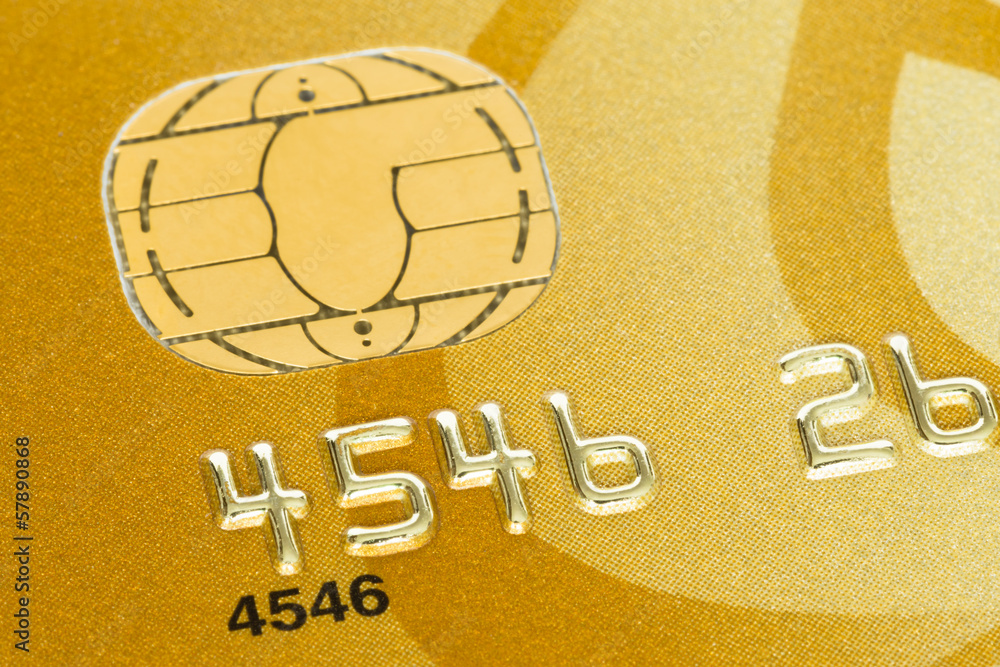 Gold credit card with micro chip selective focus Gold credit card with micro chip selective focus
