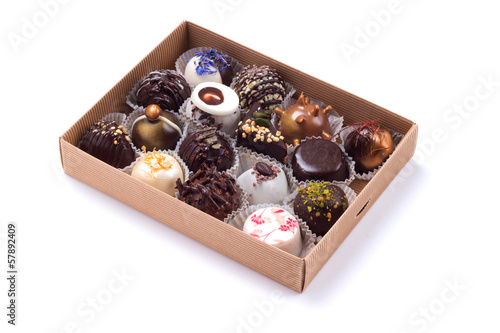 Box of handicrafted truffles isolated on white background