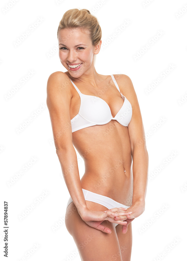 Obraz premium Portrait of happy young woman in lingerie