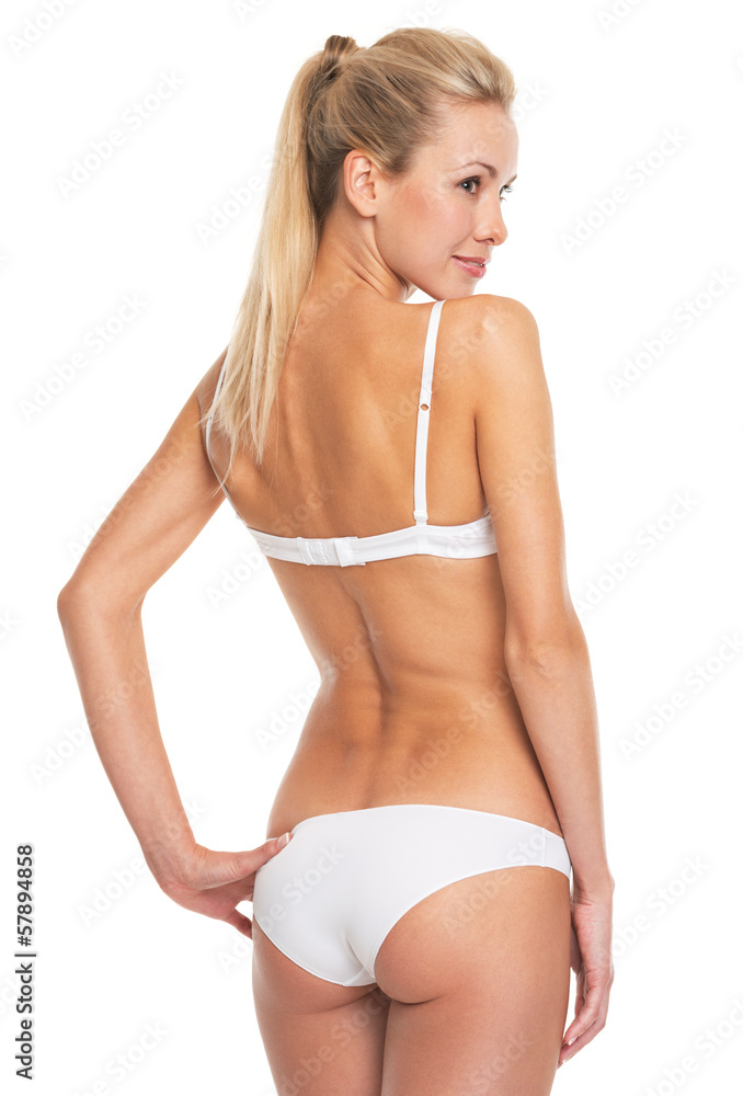 Obraz premium Portrait of smiling young woman in lingerie