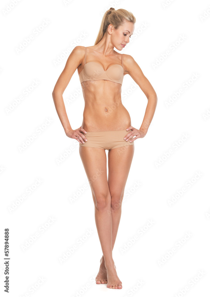 Full length portrait of relaxed young woman in lingerie Full length portrait of relaxed young woman in lingerie
