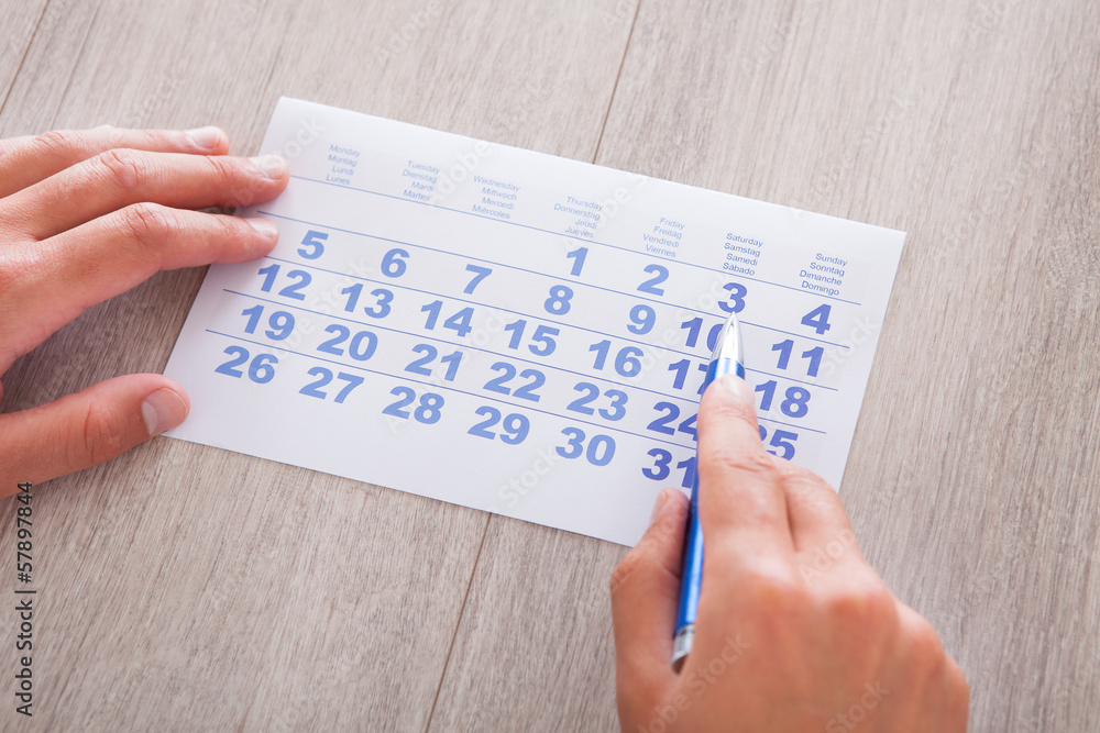 Hand Holding Calendar And Pen Hand Holding Calendar And Pen