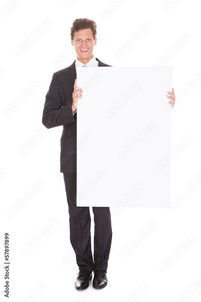Businessman Holding Blank Placard Businessman Holding Blank Placard